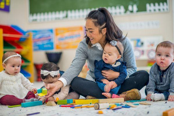 Montessori teacher with infants