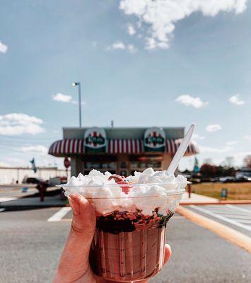 Enjoying a Sundae in front of the shop