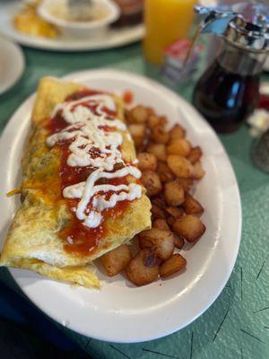 Ms. Carol's Wolf Packer Grilled Chicken and Home Fries. Added jalapeños and mushrooms to my omelette.