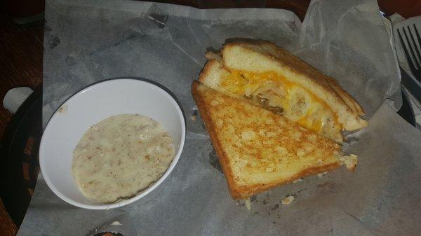 Goetta grilled cheese with hash browns and goetta gravy on the side