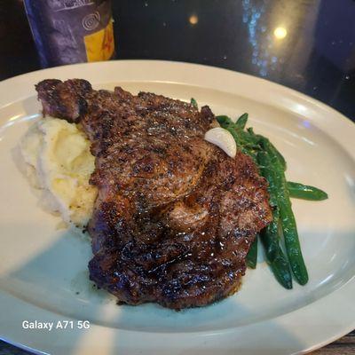 $25 rib eye & it came with 2 sides