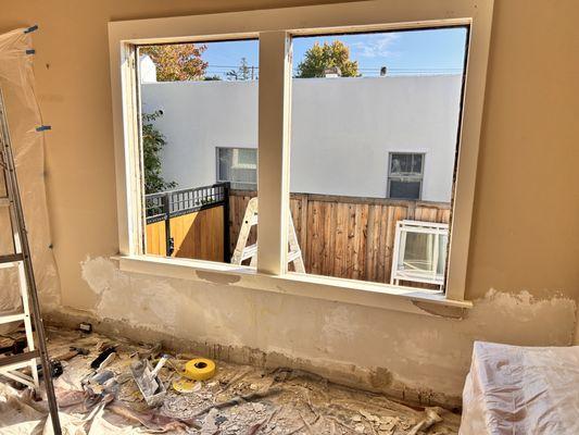 in progress: window and plaster repair