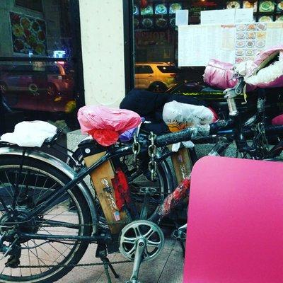 Bicycle lady's money making machine. Check out those fluffy pink hand warmers on the handkebars