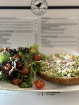 Avocado toast with fresh salad.