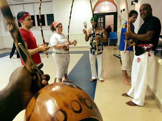 Learning capoeira muaic