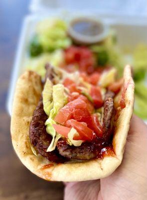 Their Classic gyro with 3 beef strips topped with shredded iceberg, tomatoes, MADD spicy sauce all wrapped in a warm pita