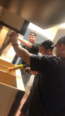 Handy husbands installing a kitchen. Rich, Christiaan and Tripp