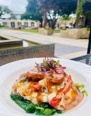 Lunch special - Achiote chicken breast stuffed with jack cheese and onions, served on a bed of creamy whipped potatoes and sautéed spinach,