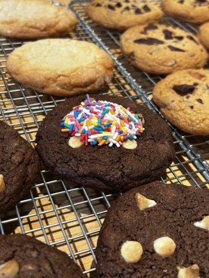 Chocolate Birthday Cake! Double chocolate cookie w/ confetti chips, vanilla frosting & rainbow sprinkles.