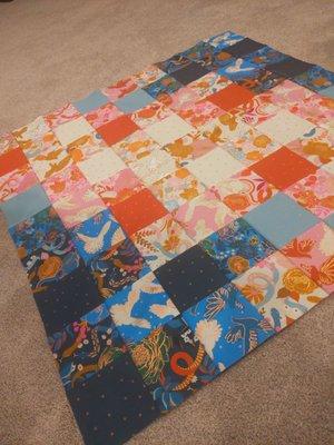 Made a quilt top out of two charm packs I bought there!