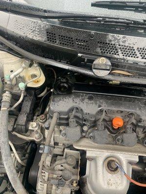 Oil all over the engine with the cap sitting above