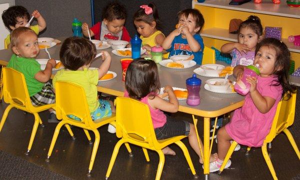 Toddlers enjoy lunchtime!