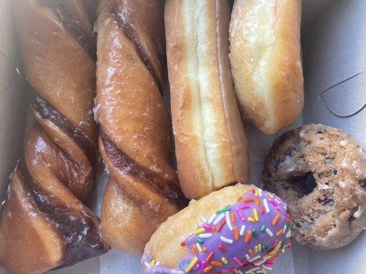 Tiger, maple, glazed, Simpson, and blueberry cake donut.