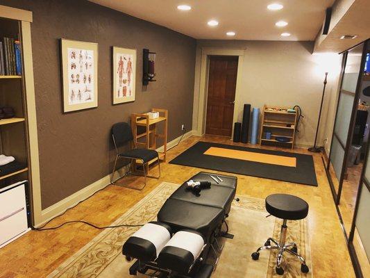 A space for Dr. Michael to review at-home and corrective exercises within the treatment room.