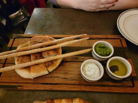 Pannelle board: pizza bread + crostini + whipped ricotta + olive oil + pesto