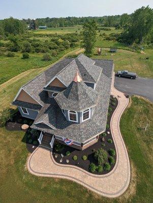 Drone shot of a property we did a wrap around sidewalk, patio, and full landscape at.