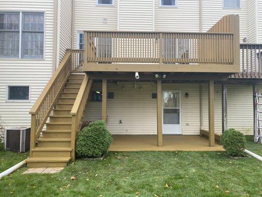 Stained unfinished pressure treated 2 level deck