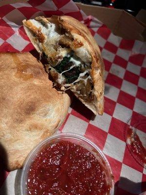 Spinach calzone with eggplant and olives