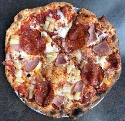 Pepperoni, ham, extra pineapple on crispy artisan thin crust