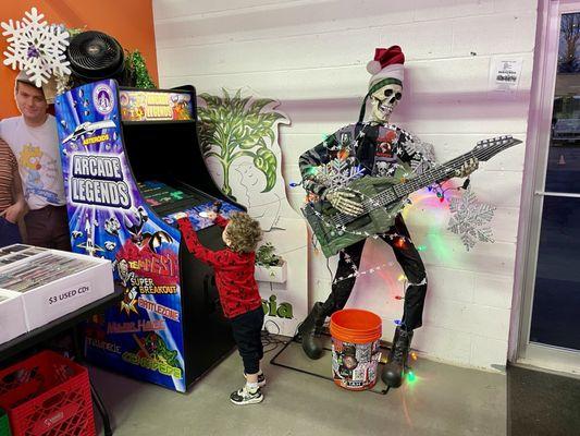 My son enjoying the arcade cabinet