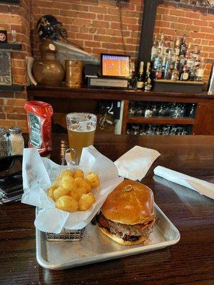 Tight Lines Burger with tots and a Tight Lines Pub Don't Feed the Seagulls draft beer.