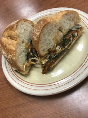 Yummy hot eggplant and spinach part on super soft Portuguese roll , Friday's #1 special!