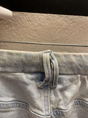 Hidden seam under belt loops for altered waistline of taking in jeans to fit - alterations from size US 14 to about an 8/10 - [~$30ish]