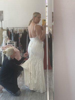 Diana showing me how to bustle my dress.