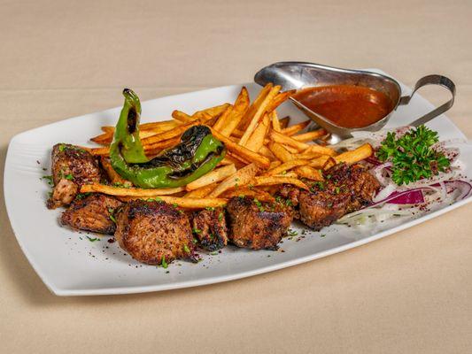 Coal charred Lamb kebab served with a side of finely cut french fries