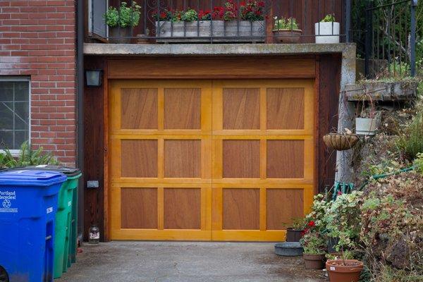 Our hand built Portland Carriage Collection custom wood door - shown in the Irvington design, configured with no windows.