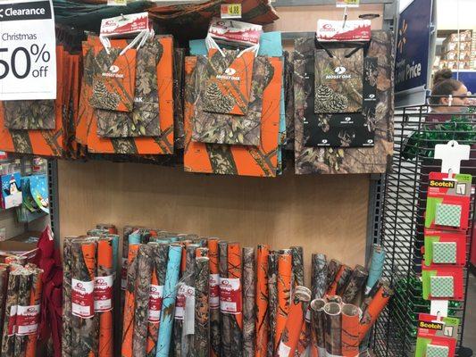 Camo gift wrap and bags courtesy of Mossy Oak. No judgement here. It's appropriate for the area.