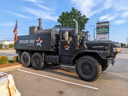 Military truck for Mission BBQ with American flags on the back. I love it. The American Way. Located in Skibo Marketplace.