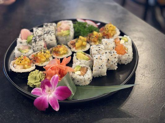 From right to left:  Phili roll, Specialty roll with some white tuna,  Costume roll with Yellowtail, avocado and deep fried asparagus