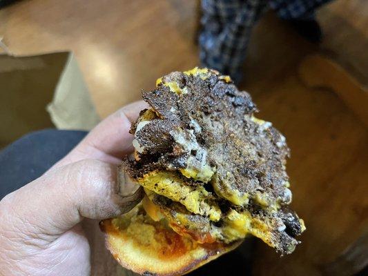 Looks like.......it is a cheese burger. Very burnt