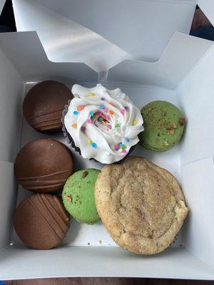 Chocolate and pistachio macarons ($2.75/ea)...chocolate cupcake (forgot...maybe $3?) and a snickerdoodle ($2)