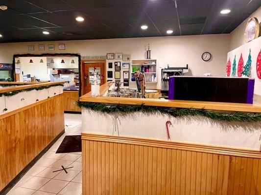 View from the entrance of the front counter and into the kitchen & pickup area