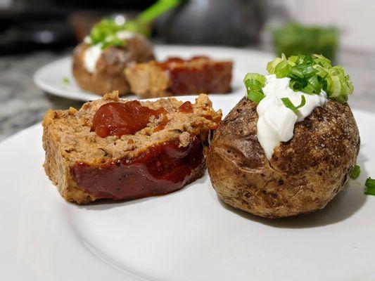 Homemade beef and turkey meatloaf and salted baked potato. Ingredients from Whole Foods Chapel Hill.