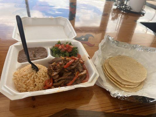 Fajita paradilla with rice and refried beans.