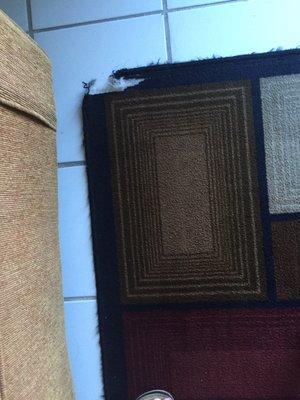 Rug torn on 2 corners.