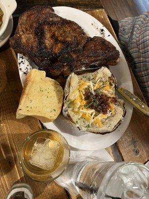 Bone-in ribeye with baked potato