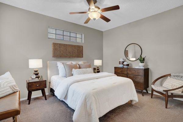 Bedroom with ceiling fan at Carrollton Park of North Dallas