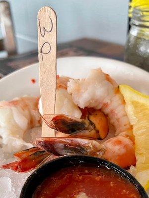 3 very large fresh shrimp cocktail on ice with lemon and horseradish sauce