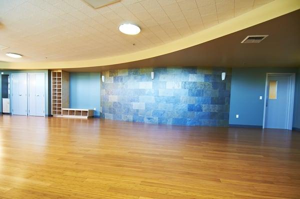 Our Yoga-friendly Energy Studio features a curved slate wall and bamboo floors.