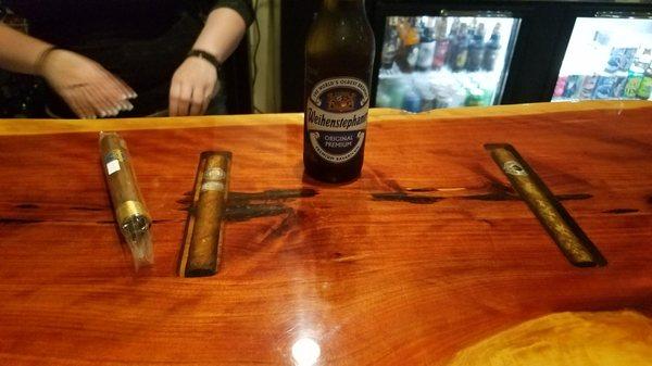 Cool bar with cigars recessed into the wood