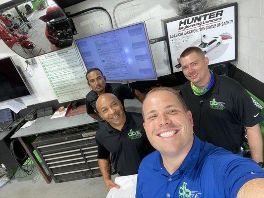 Our damage analysis team reviewing a blueprinted vehicle and communicating all the specifics of the repair prior to production.