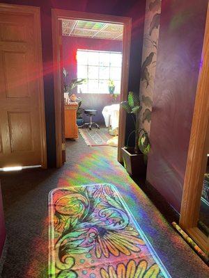 Decals on the window make the space dance with rainbows. Great natural light