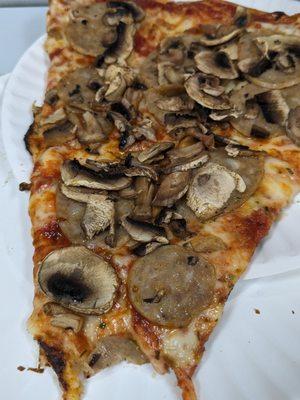 Giant mushroom sausage slice