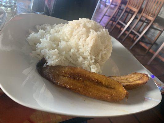 Rice and plantains apart of Lomo Salteado