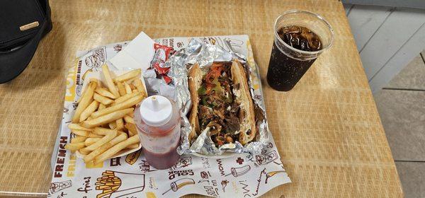 Cheese steak and fries with coke zero sugar