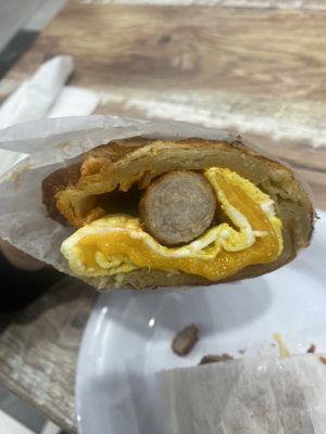 Sausage (pork), egg, and cheese sandwich on a croissant